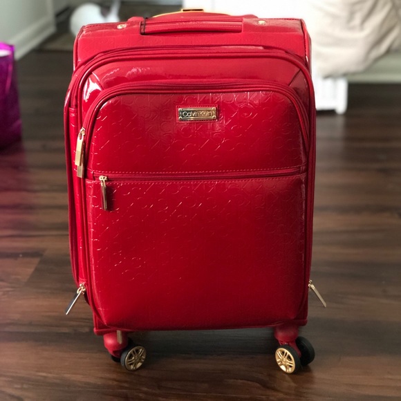 red calvin klein luggage